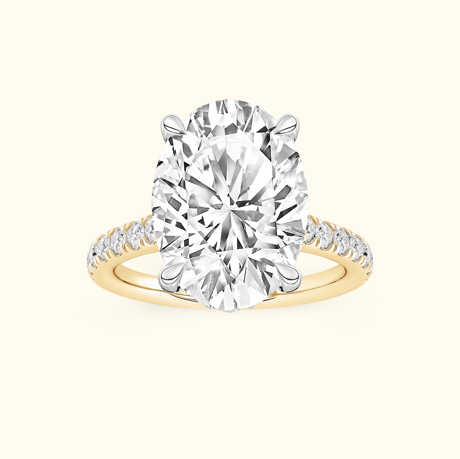 Oval diamond engagement ring with a gold band and smaller diamonds along the shank.