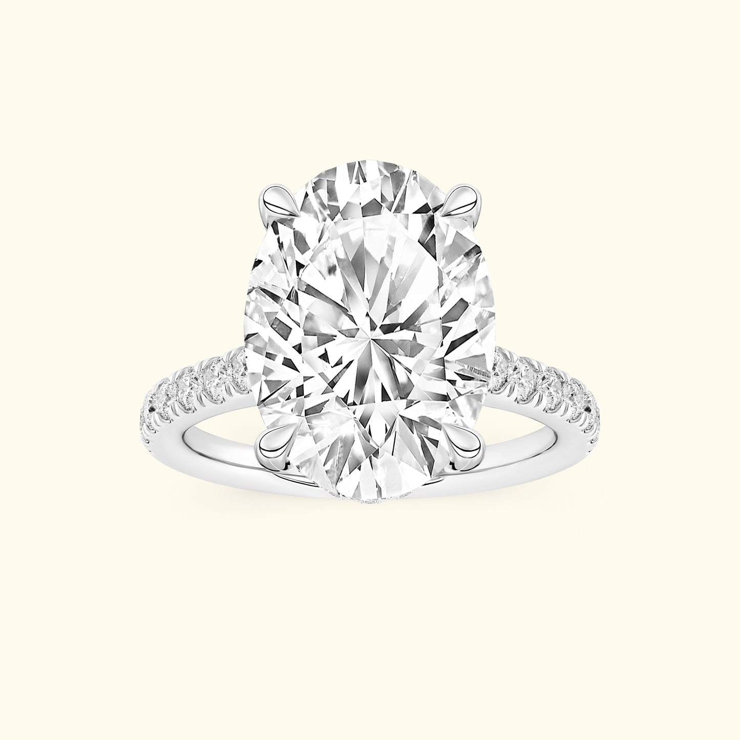 Oval diamond engagement ring with a sleek band and sparkling side stones.