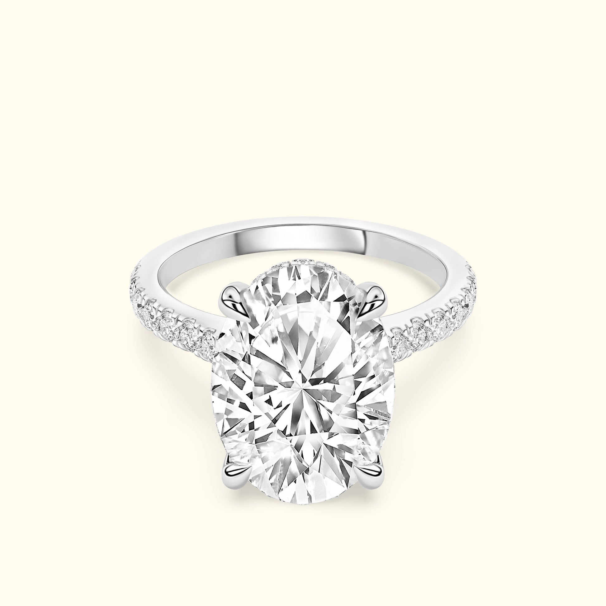 Elegant oval diamond engagement ring with a sparkling pavé band.