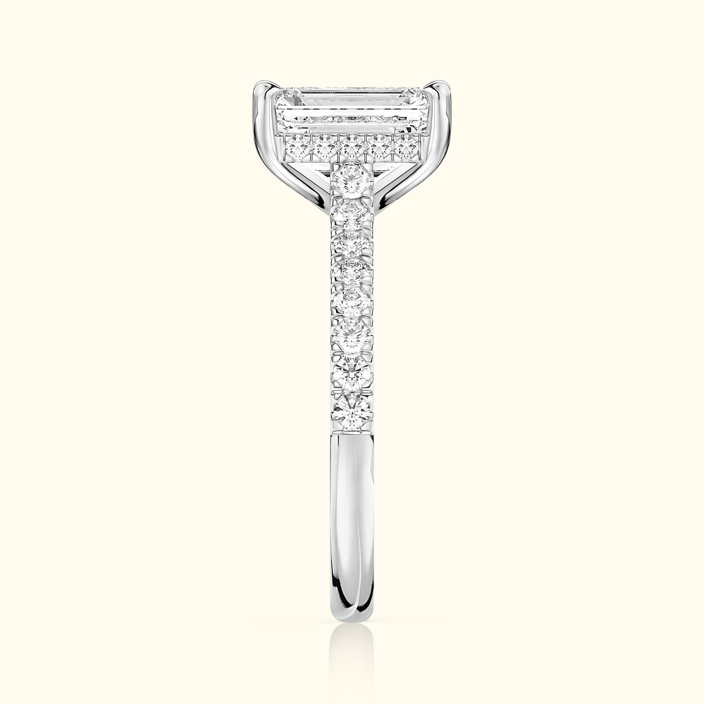 Elegant diamond ring with a rectangular center stone and a sparkling band.