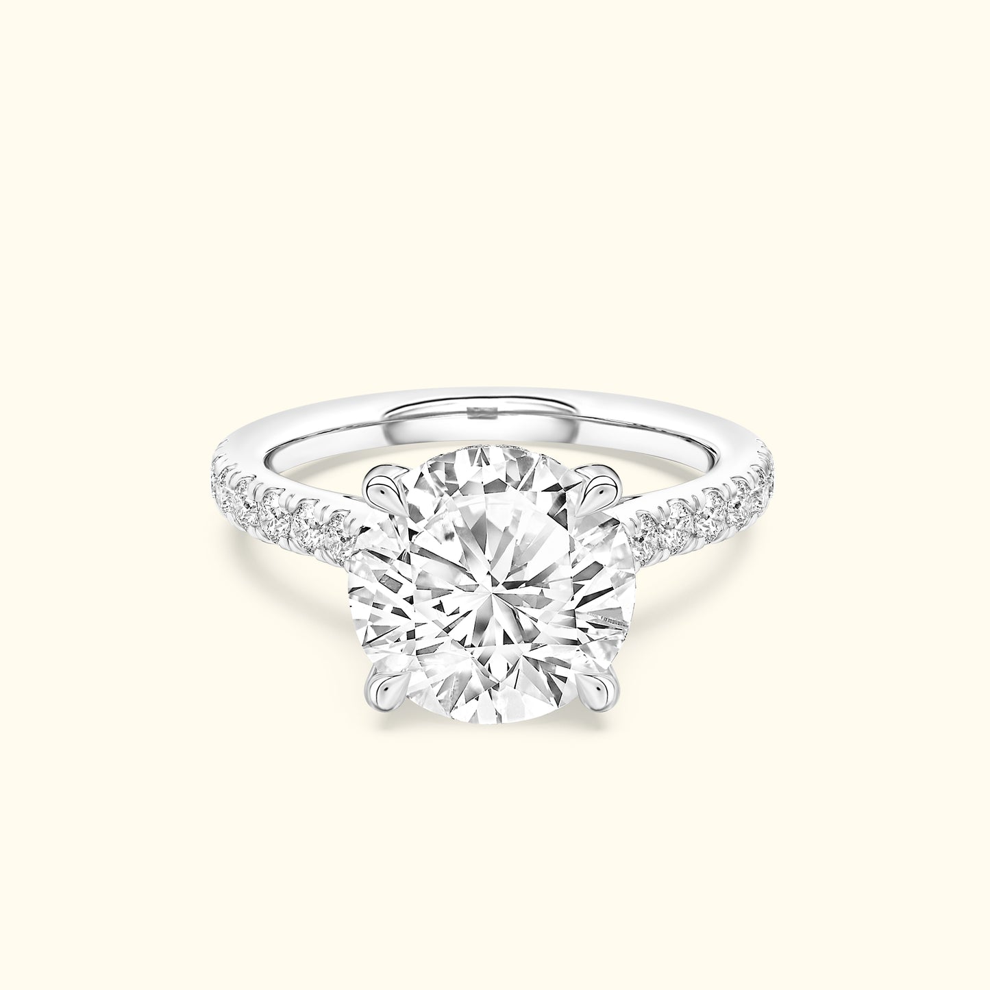 Elegant engagement ring featuring a large round diamond and small accent stones on the band.