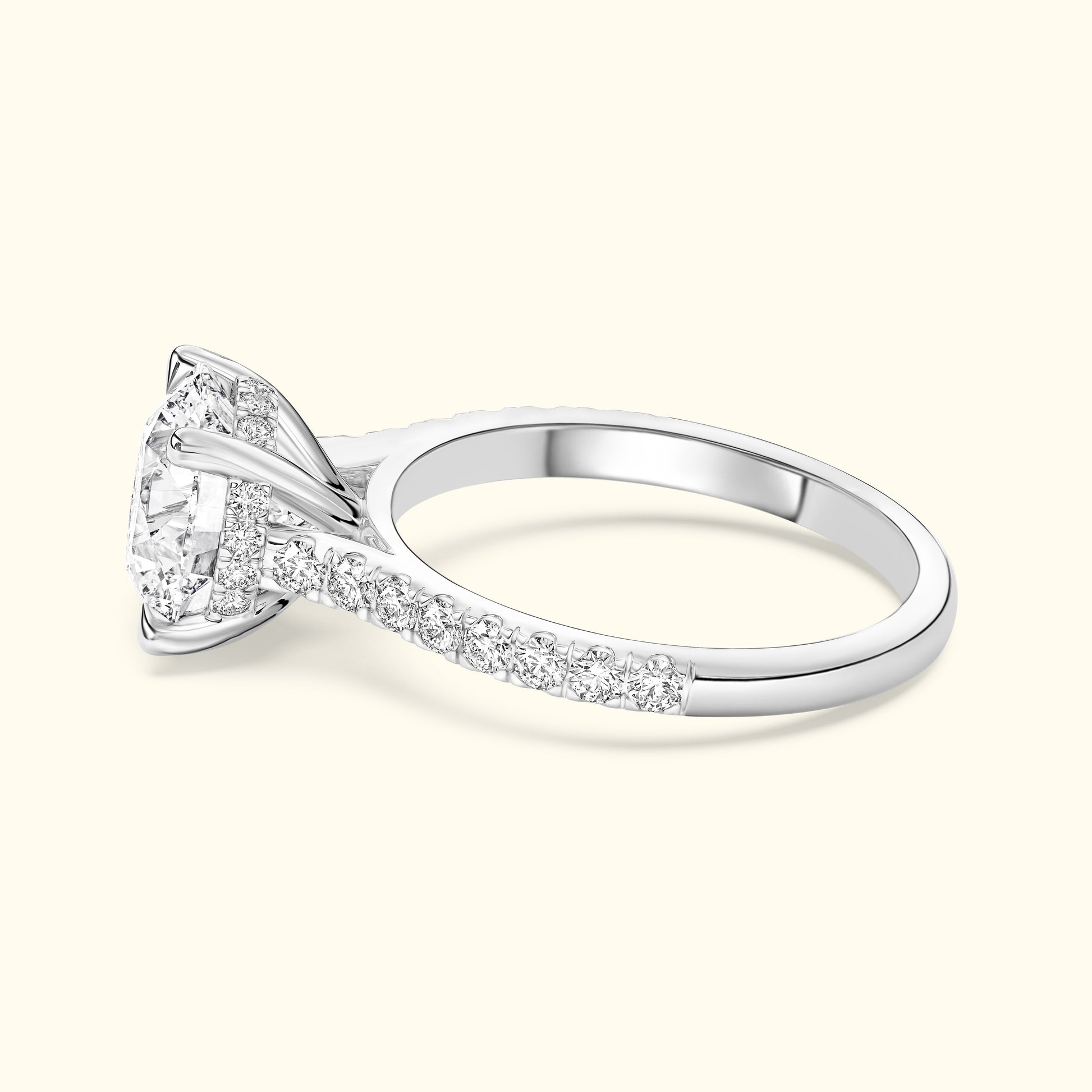 Elegant silver ring with a large diamond and smaller stones along the band.