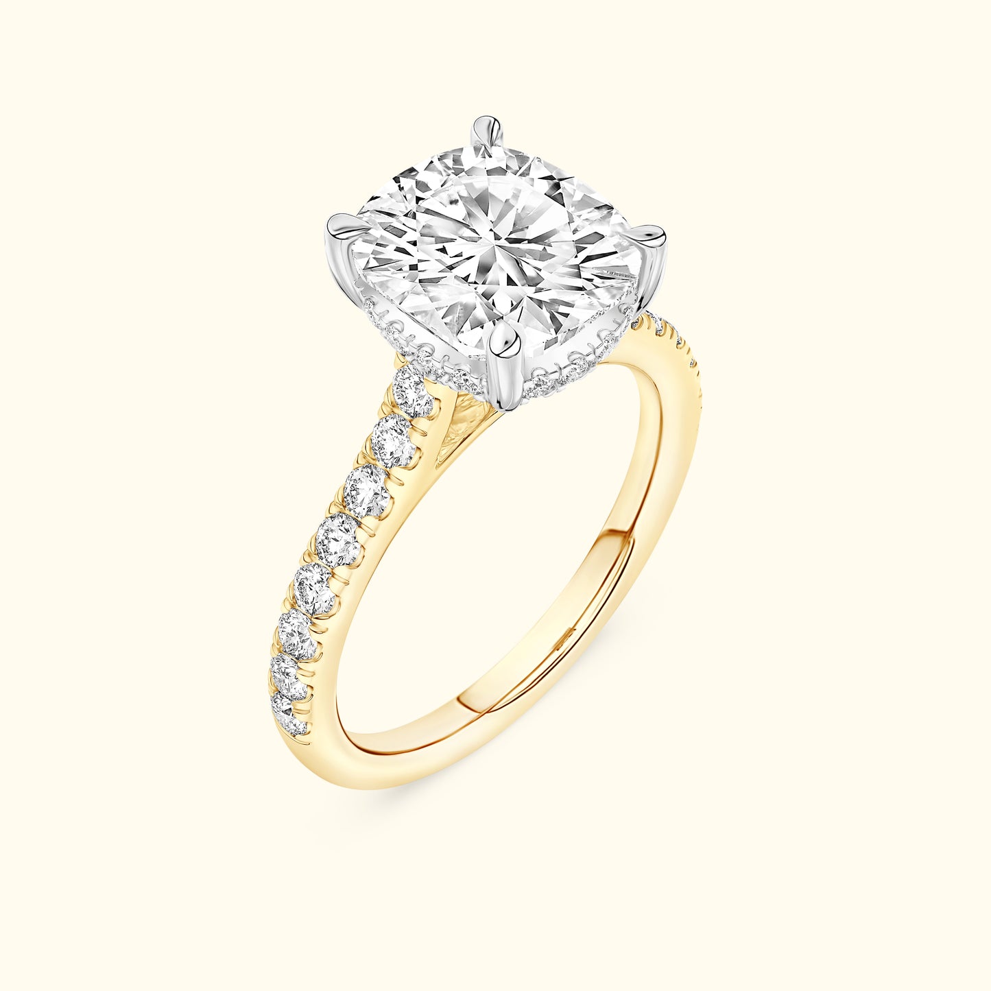 Yellow gold engagement ring featuring a large round diamond and smaller diamonds along the band.