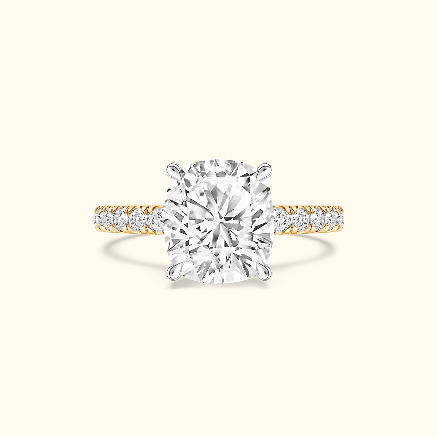 Cushion-cut diamond ring with a gold band and smaller diamonds along the shank.