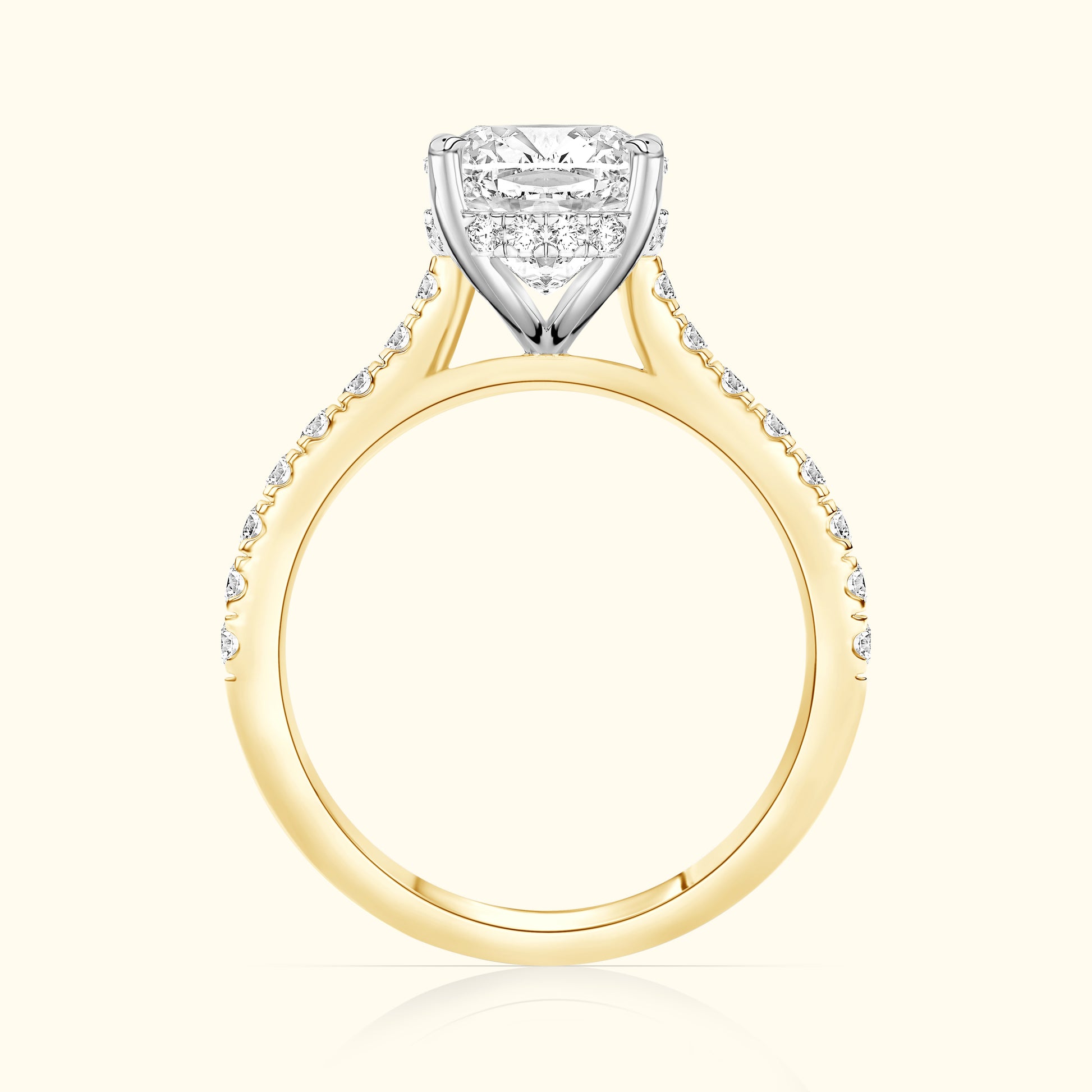 Solitaire diamond engagement ring with a yellow gold band and white gold setting.