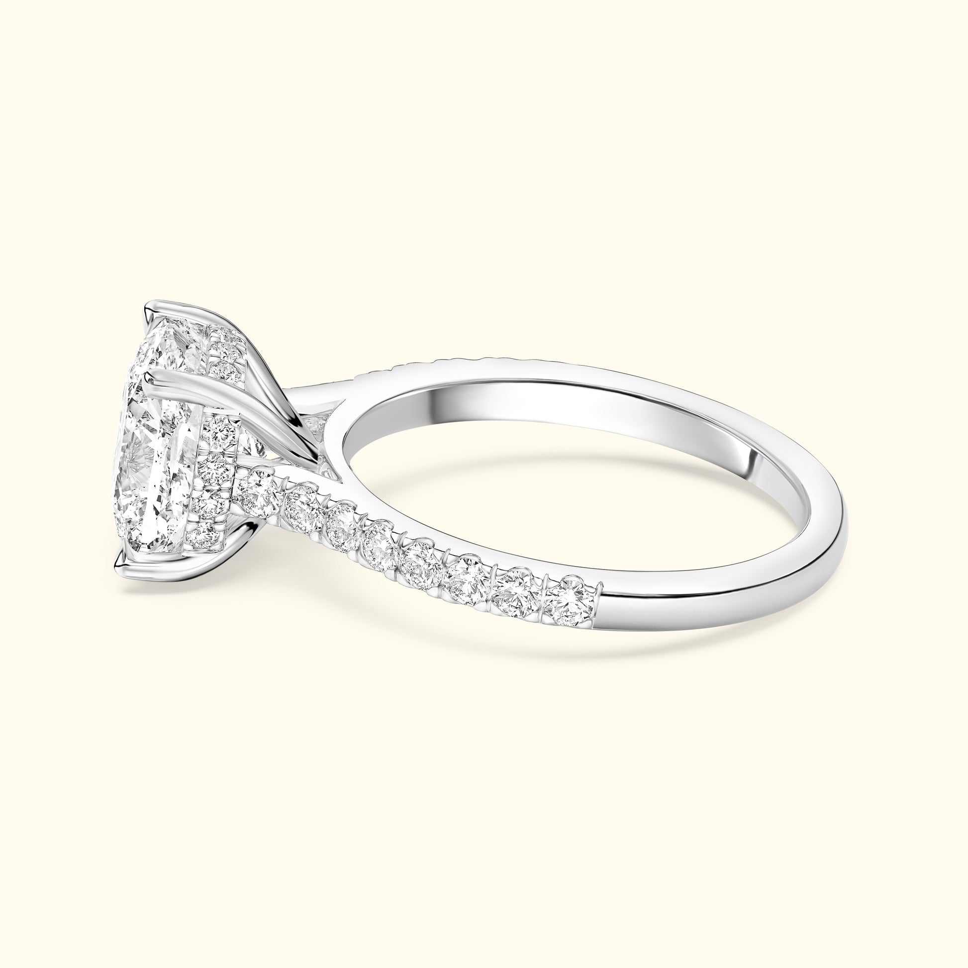 Elegant silver ring featuring a large rectangular diamond and smaller accent stones.