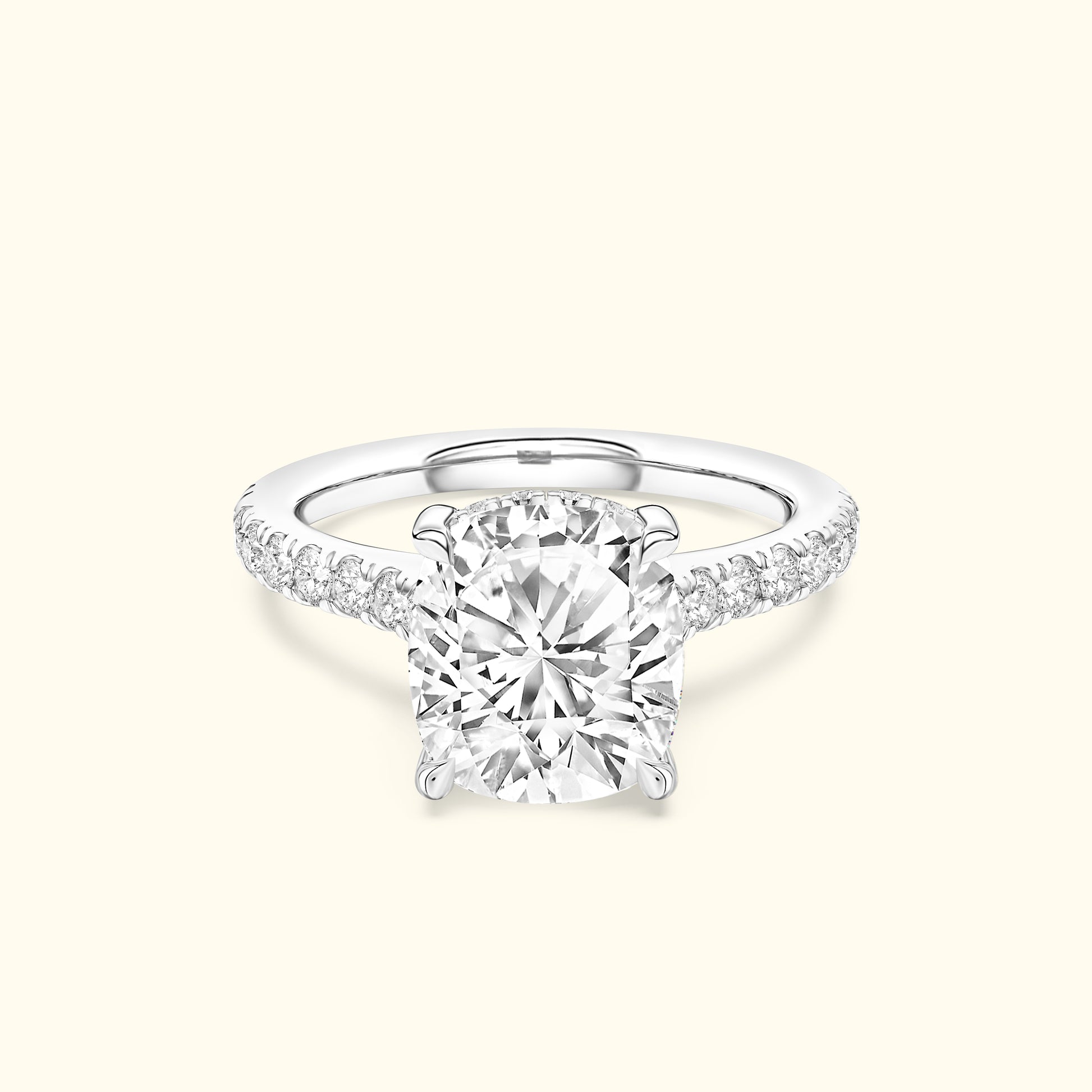 Solitaire diamond ring with a round center stone and diamond-accented band.