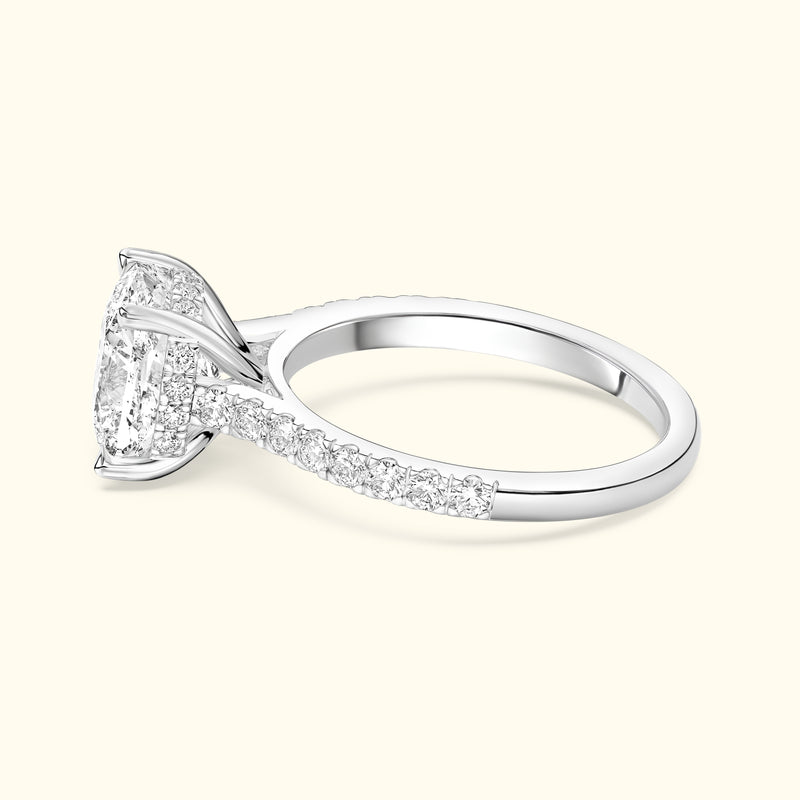 Elegant silver ring with a large center diamond and smaller diamonds along the band.