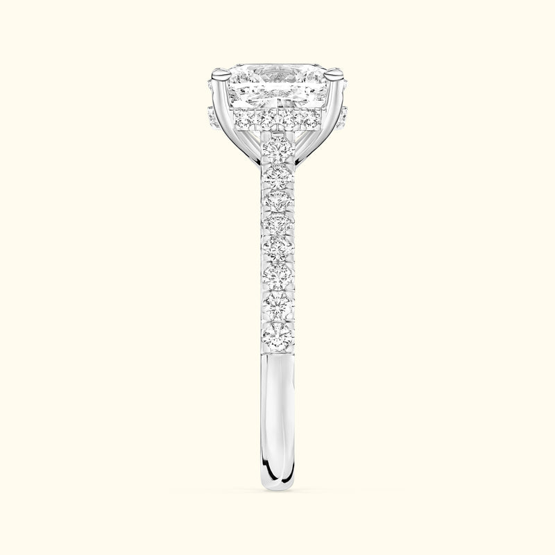 Elegant diamond engagement ring featuring a rectangular center stone and a sparkling band.