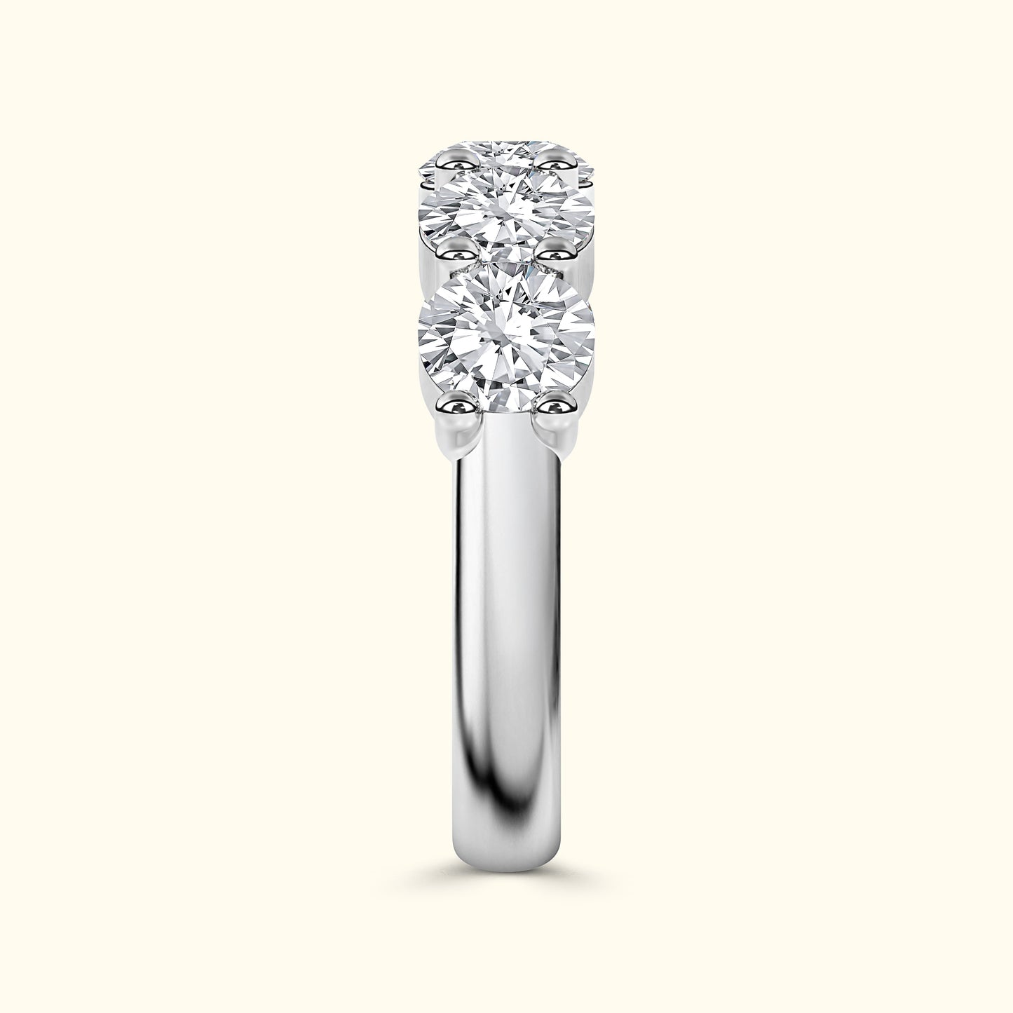 Three-stone diamond ring with a polished white gold band.