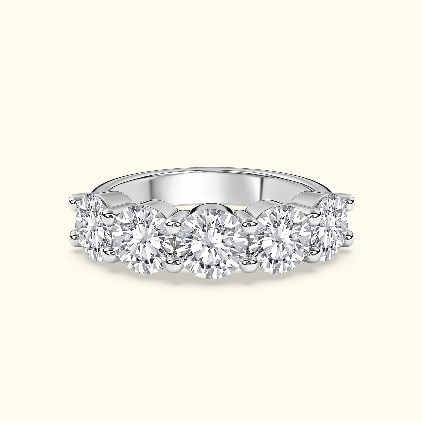 Elegant diamond band featuring five round brilliant stones set in white gold.