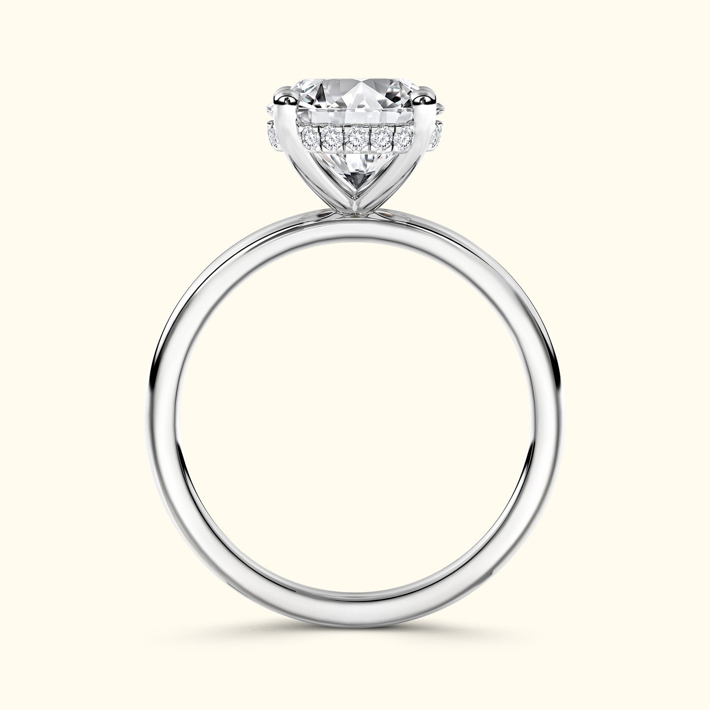 Solitaire ring with a large round diamond and smaller sidelights on a smooth silver band.