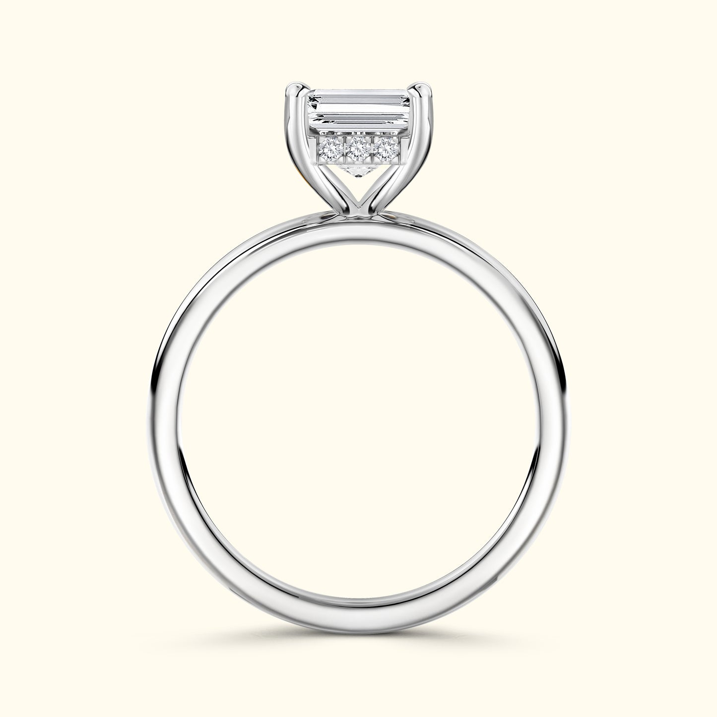 Elegant silver ring featuring a central emerald-cut diamond with smaller accent stones.