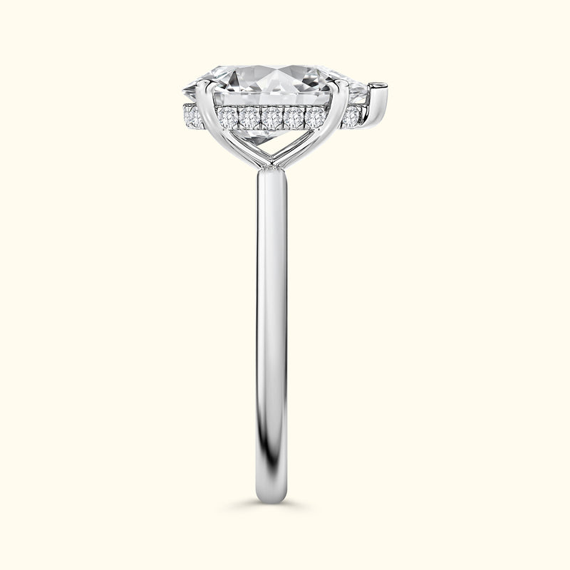 Elegant silver ring with a large center diamond and smaller diamonds accenting the band.