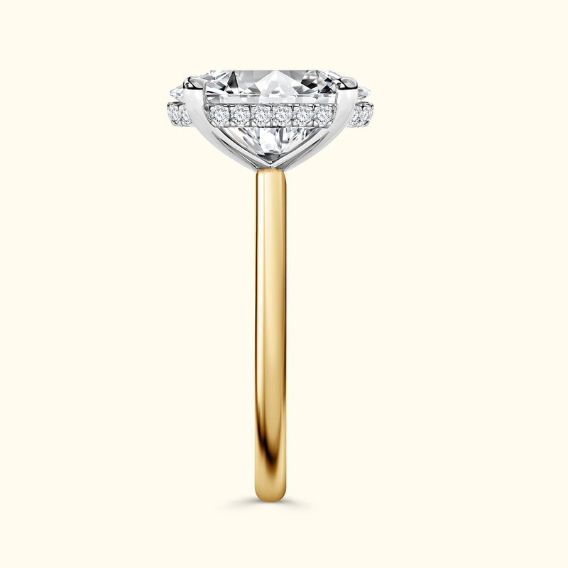 Elegant diamond engagement ring with a gold band and sparkling side accents.