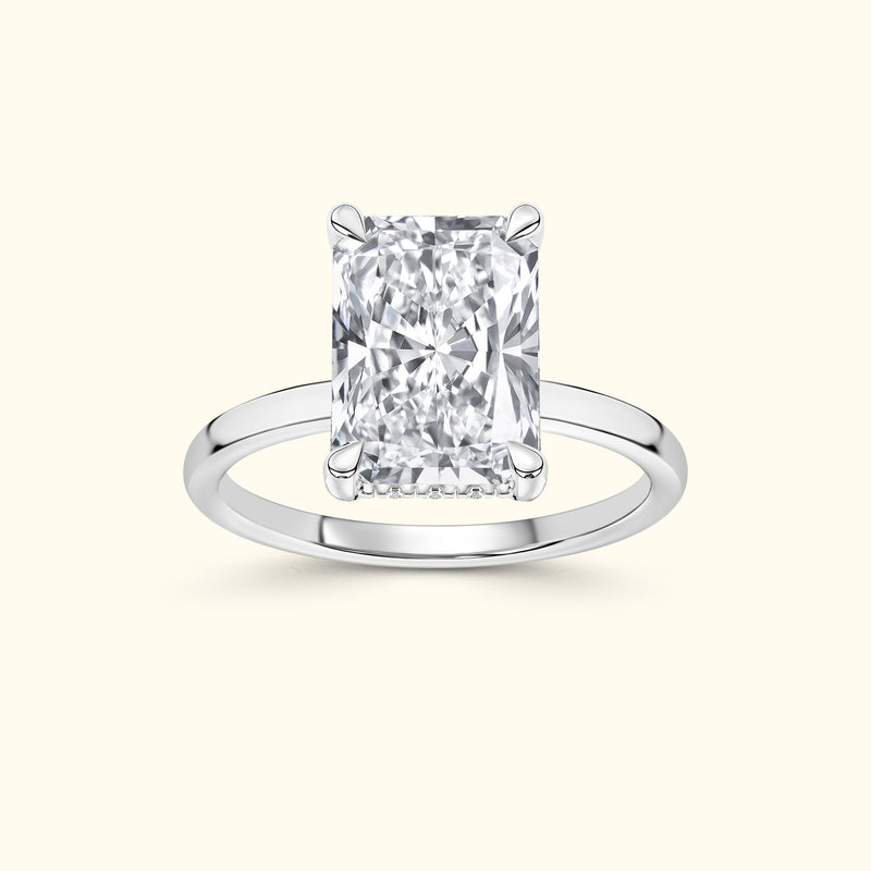 Elegant rectangular diamond ring set in a polished silver band.