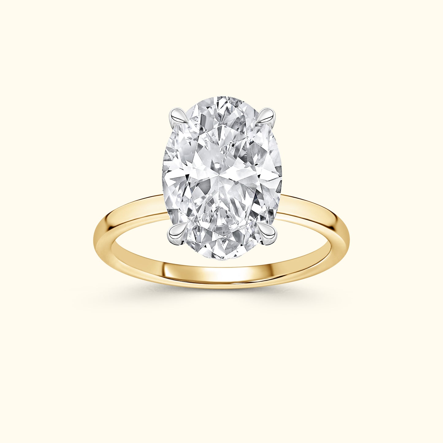 Oval diamond ring set on a yellow gold band.
