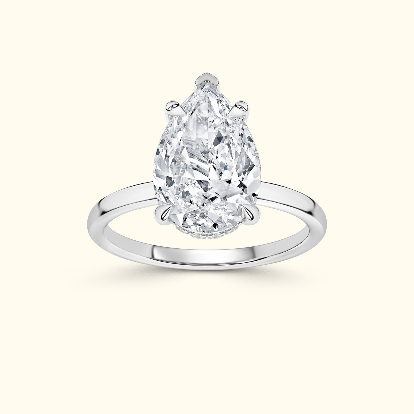 Elegant pear-shaped diamond ring on a simple silver band.