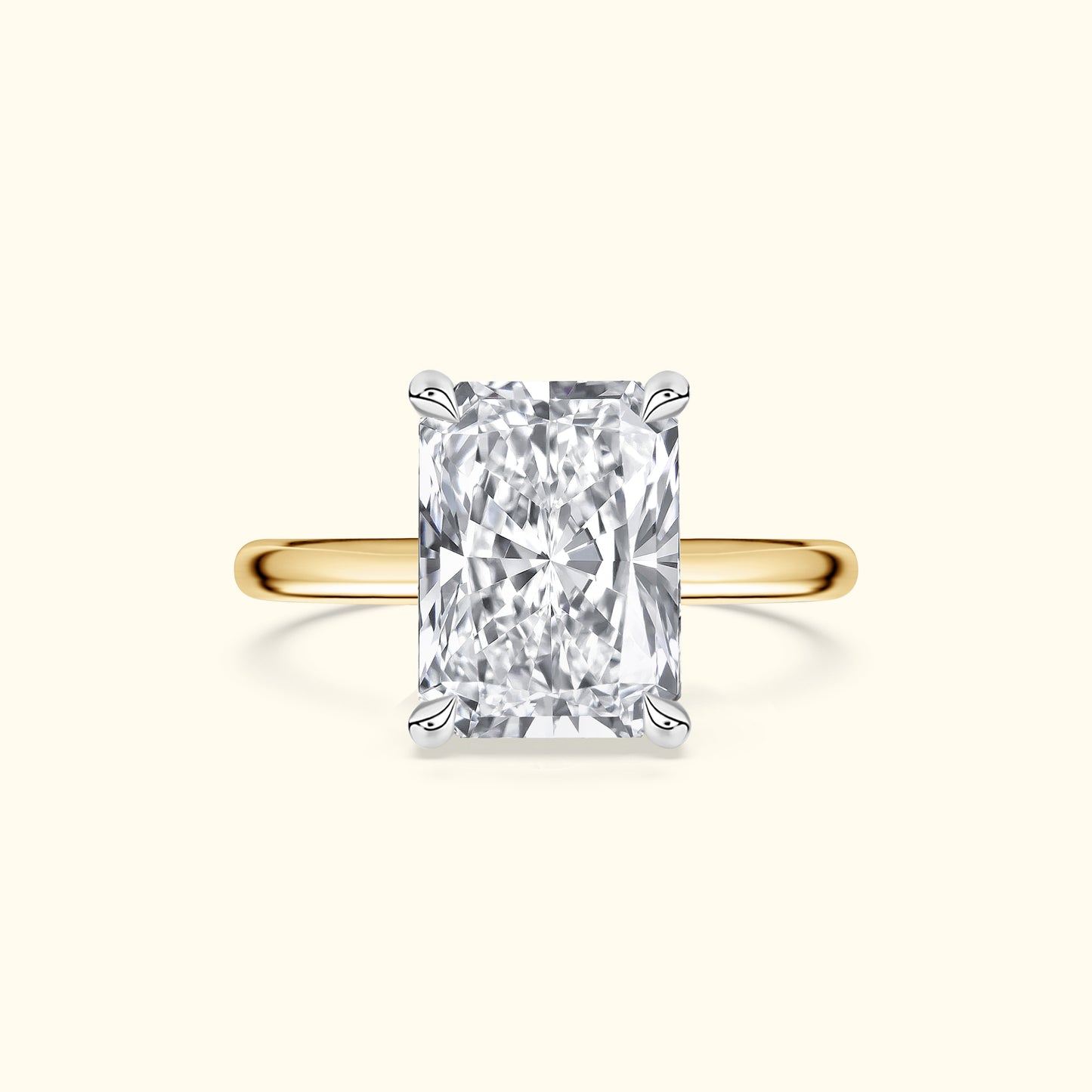 Rectangular diamond engagement ring with a yellow gold band.