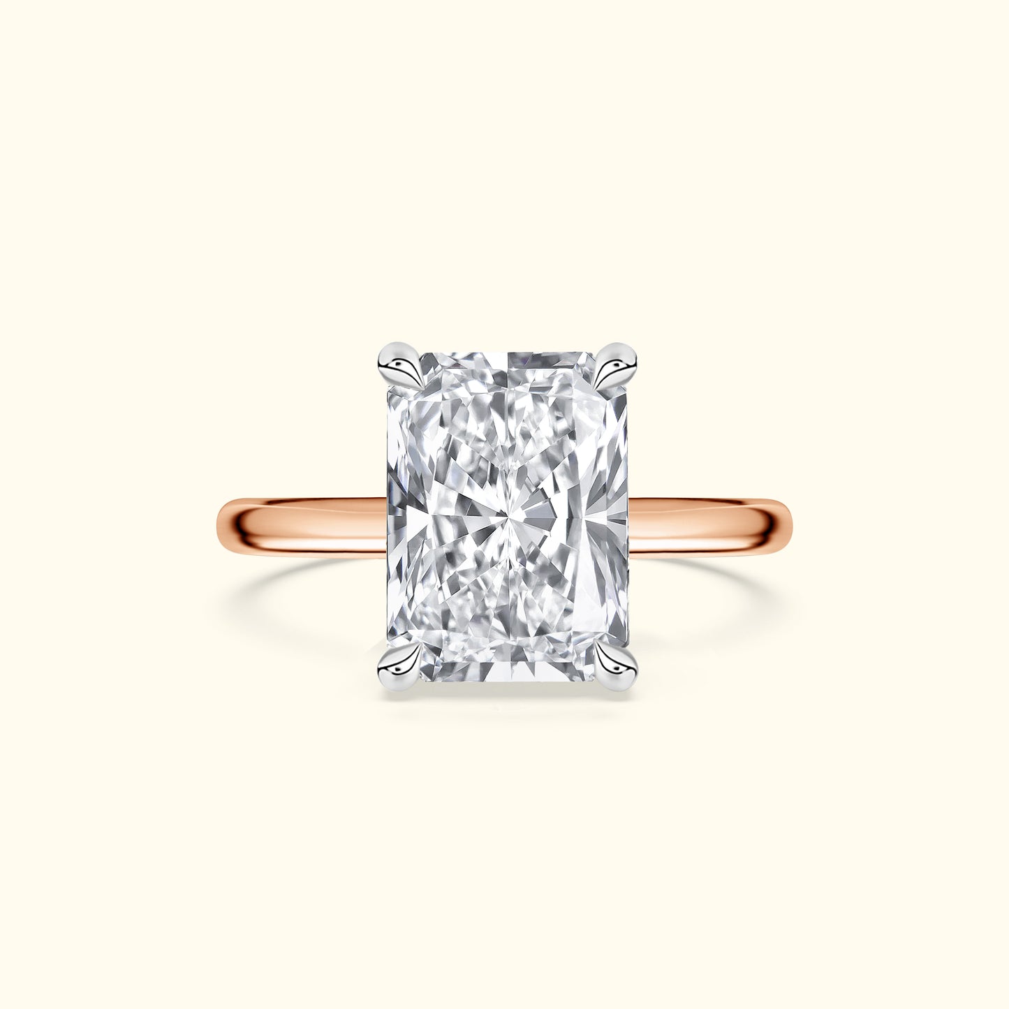 Rose gold ring featuring a large rectangular diamond centerpiece.