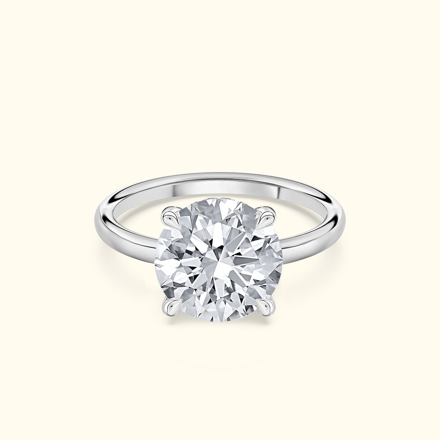 Diamond solitaire ring with a round cut stone set in a simple silver band.