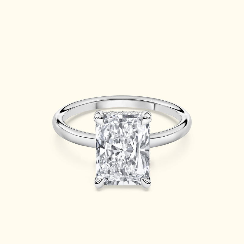 Stunning rectangular diamond engagement ring set in a sleek silver band.