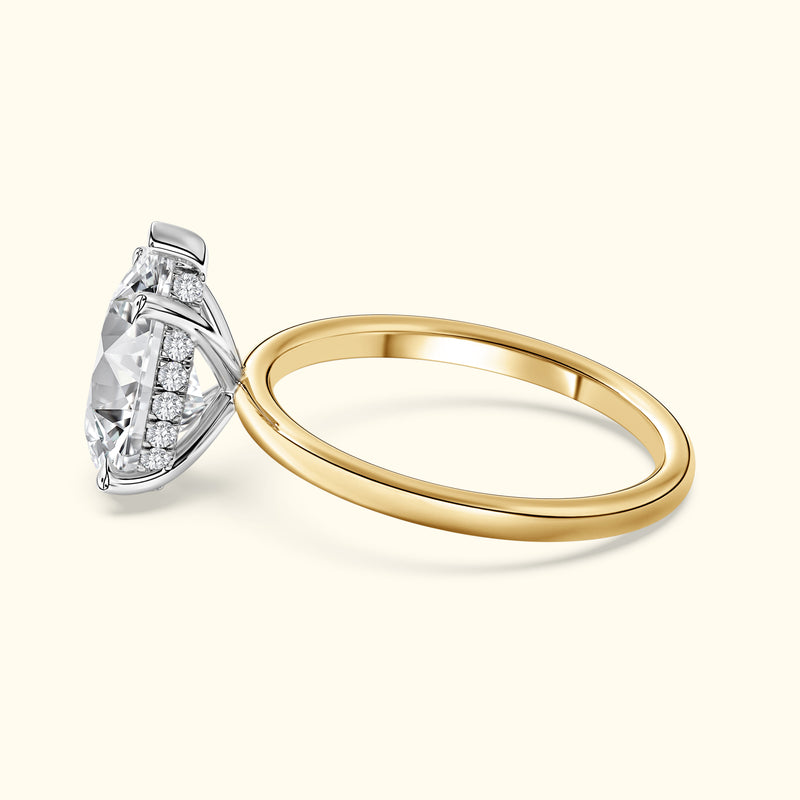 Two-tone engagement ring featuring a large diamond with a delicate band.
