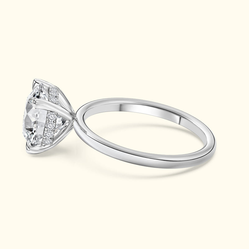 Elegant solitaire engagement ring with a large diamond and a sleek, silver band.
