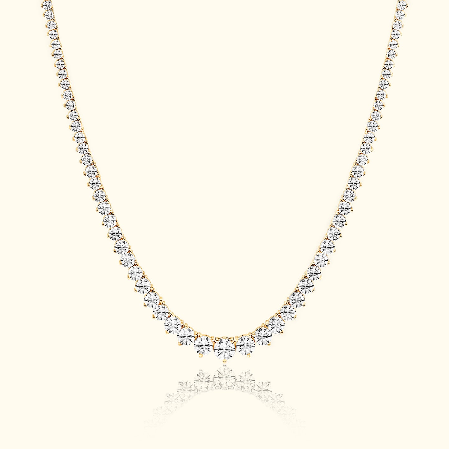 Elegant gold necklace adorned with sparkling diamonds, featuring a graduated design.