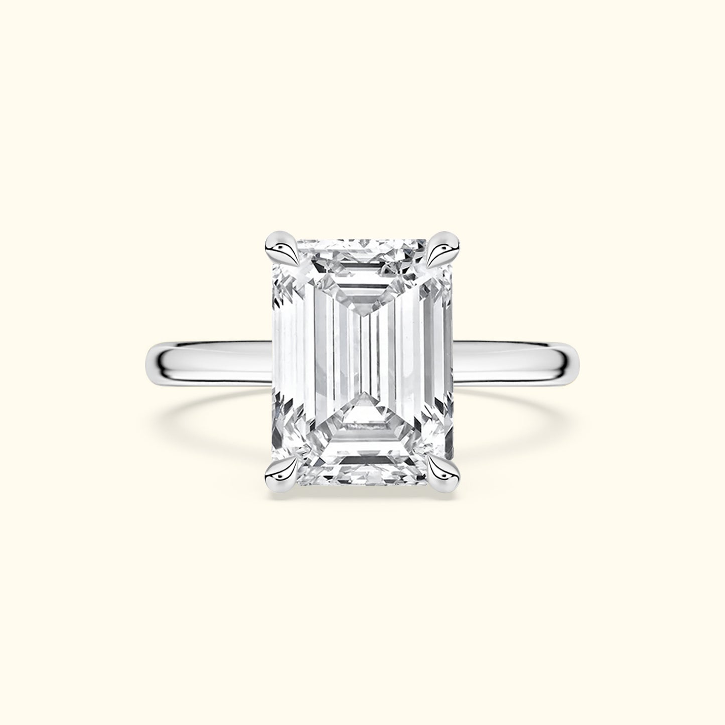 Emerald-cut diamond ring with a sleek silver band.