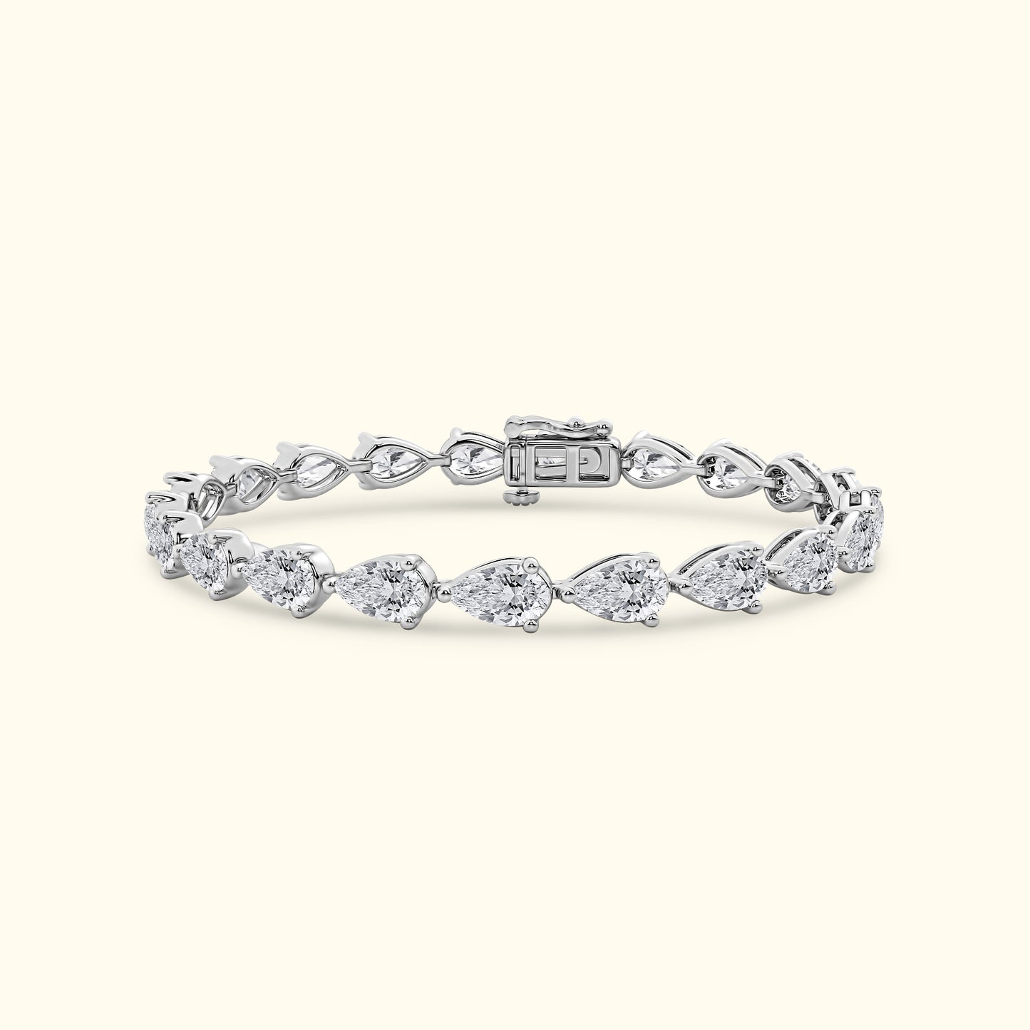 Silver bracelet with pear-shaped diamonds in a delicate arrangement.
