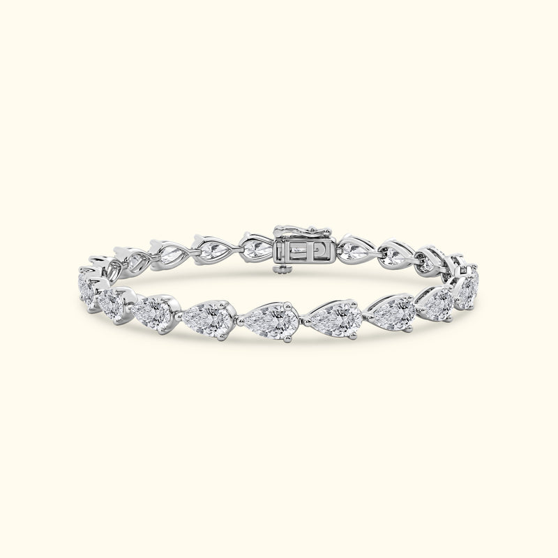 Silver bracelet with pear-shaped diamonds in a delicate arrangement.