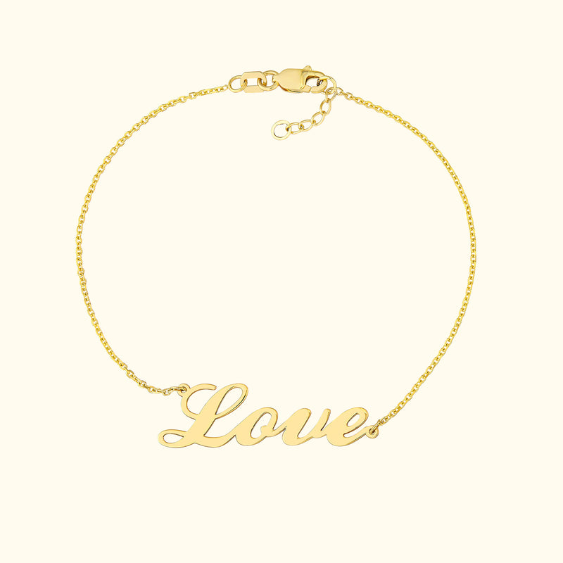 Gold bracelet with the word "Love" in a stylish, cursive font.