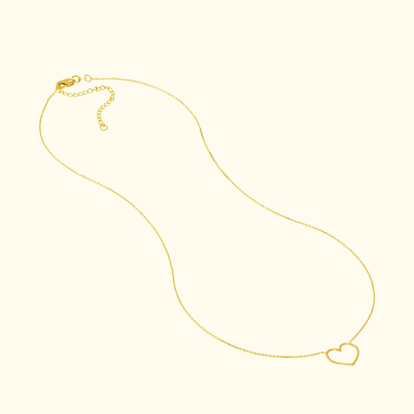 Delicate gold necklace featuring a simple heart pendant.
