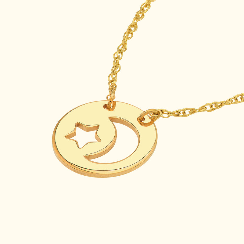Gold necklace featuring a circular pendant with a star and crescent moon design.
