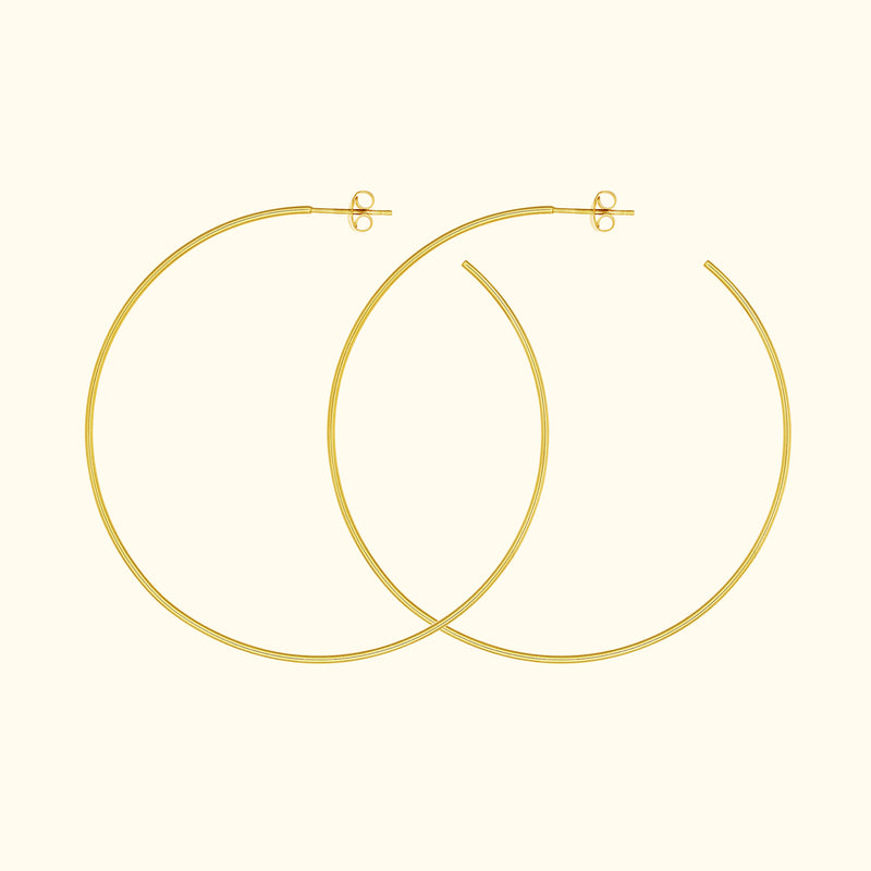 Gold hoop earrings with a simple, elegant design.