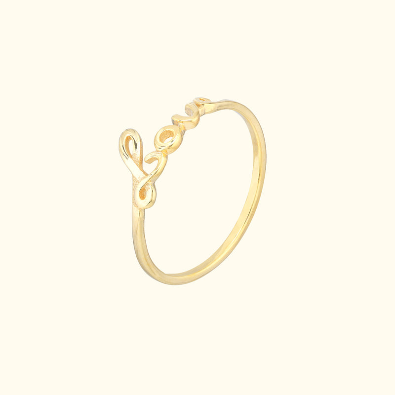 Delicate gold ring with a unique, intertwining design.