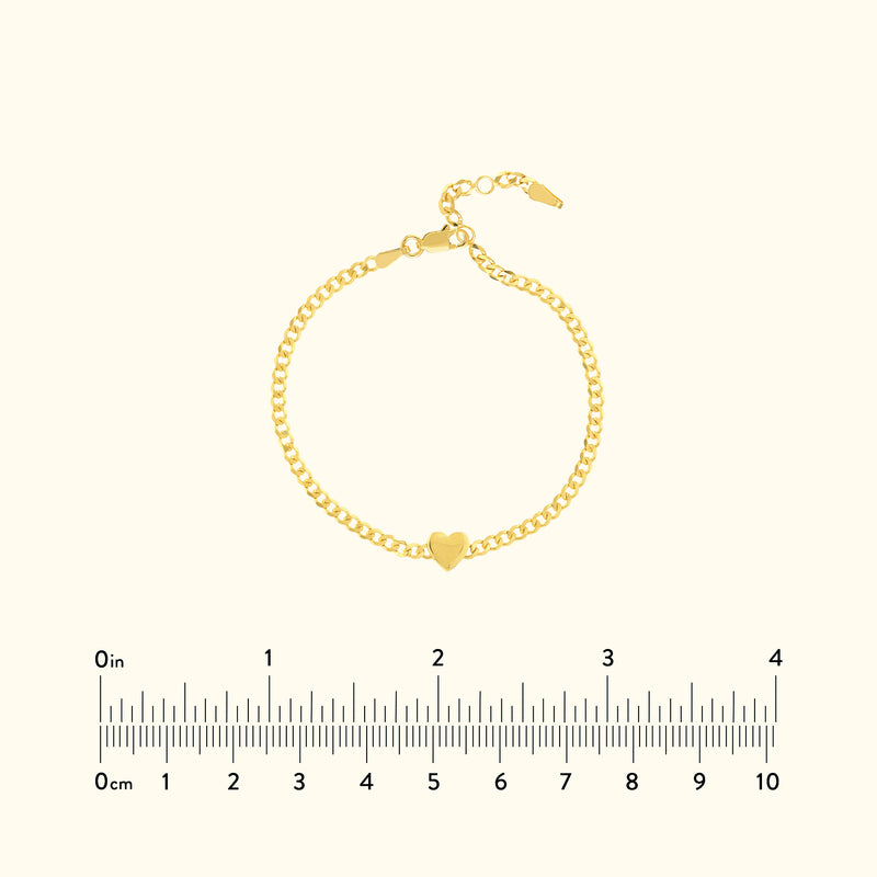 Gold bracelet with a heart charm, featuring a chain link design.
