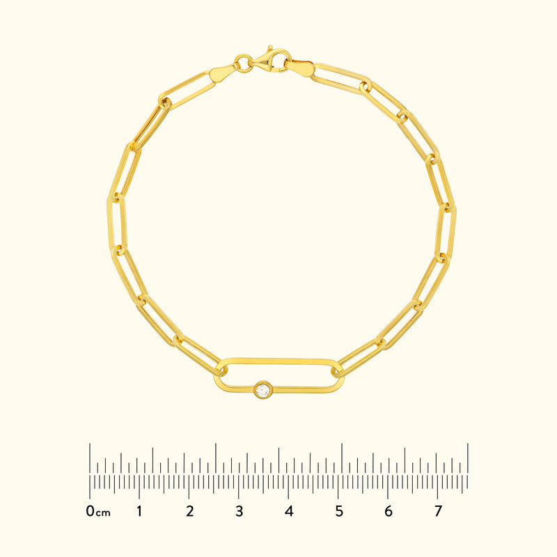 Gold chain bracelet with an oval link and a small diamond accent.