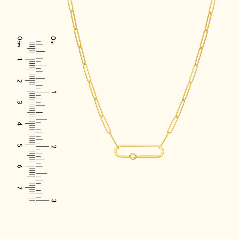 Delicate gold link necklace with a small diamond accent.