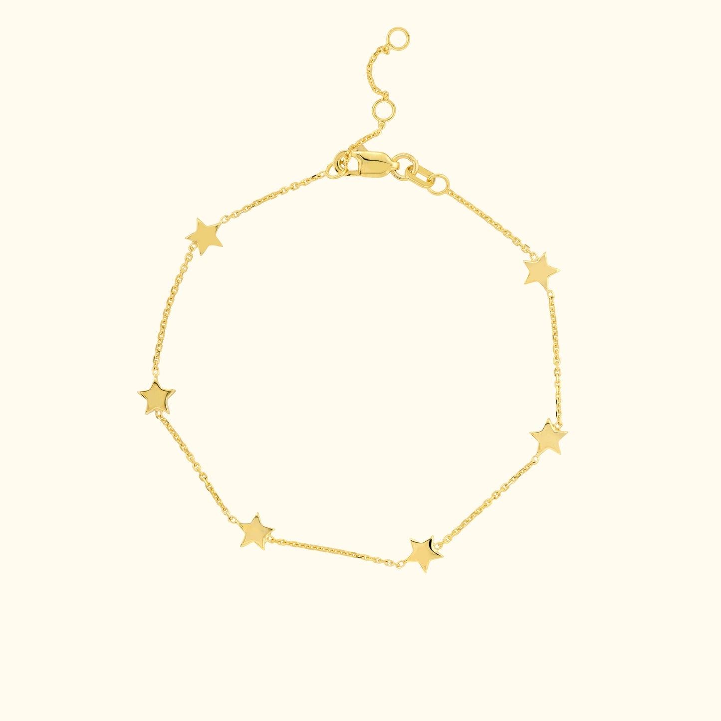 Delicate gold bracelet featuring star-shaped charms along a fine chain.