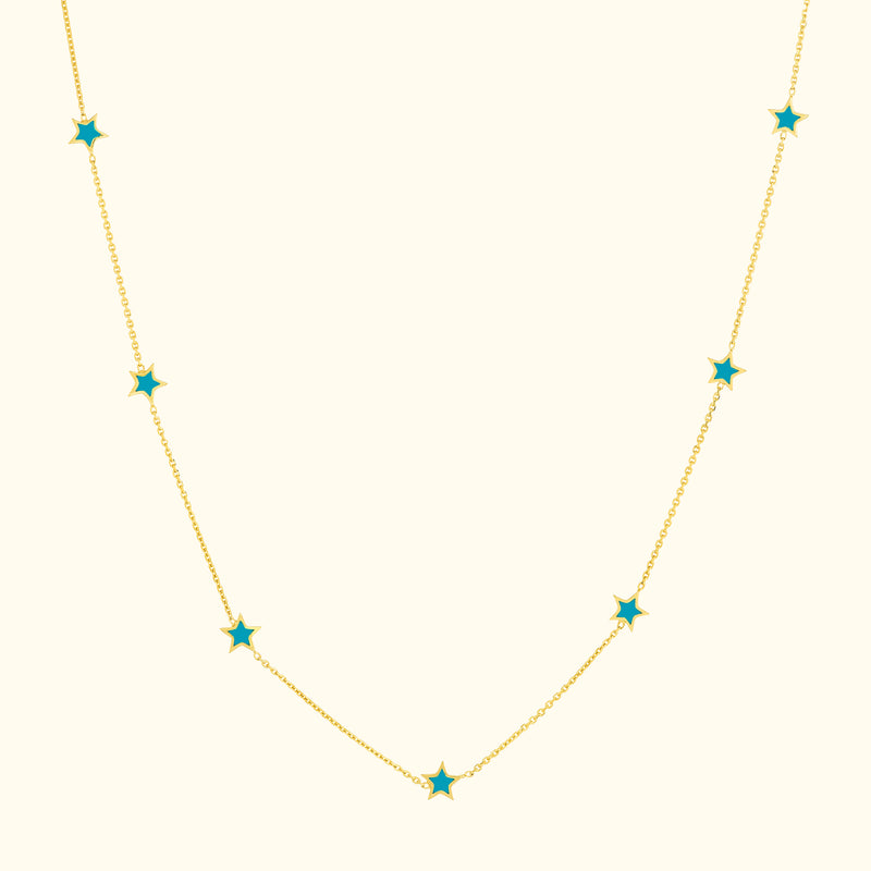 Gold necklace with star-shaped turquoise accents along the chain.
