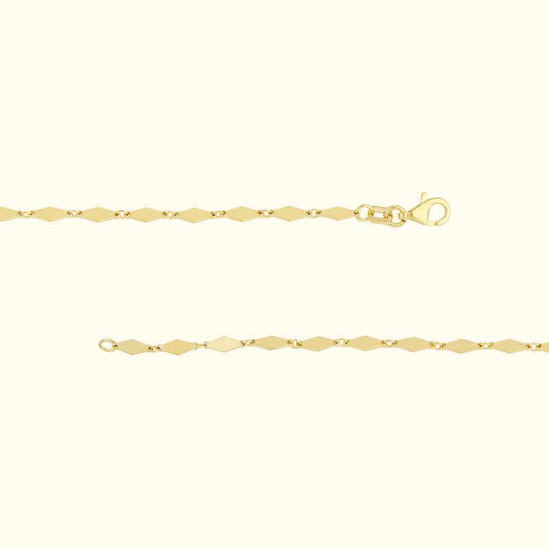 Elegant gold bracelet with diamond-shaped links and a lobster clasp.