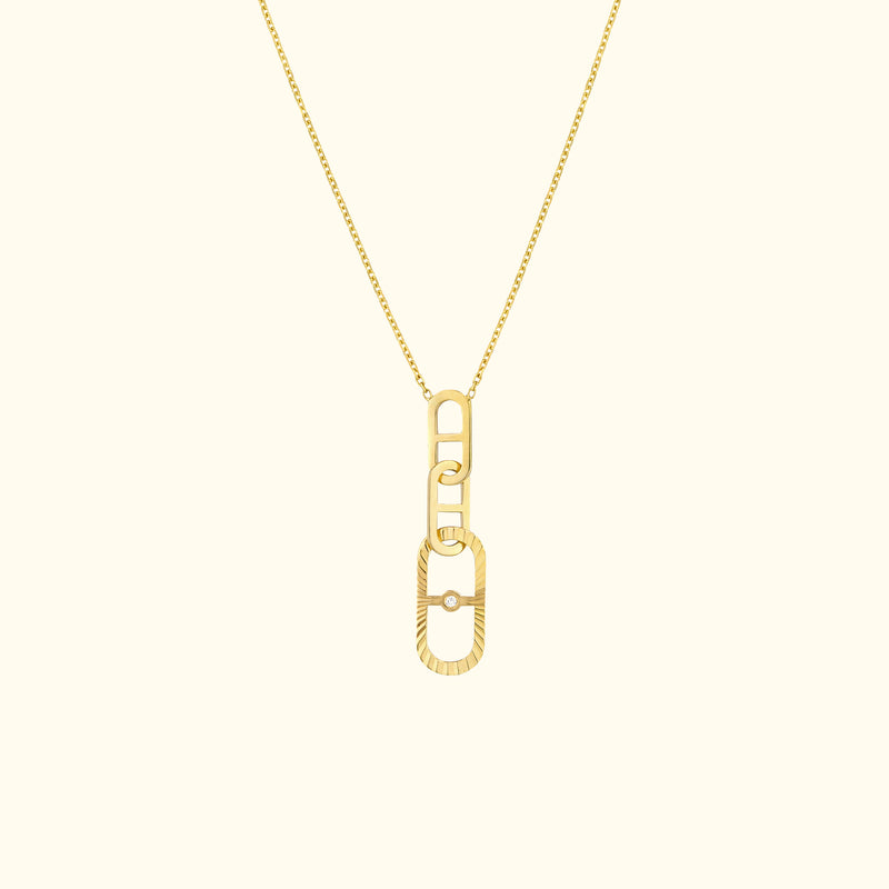 Gold chain necklace featuring a modern, interlocking link pendant.