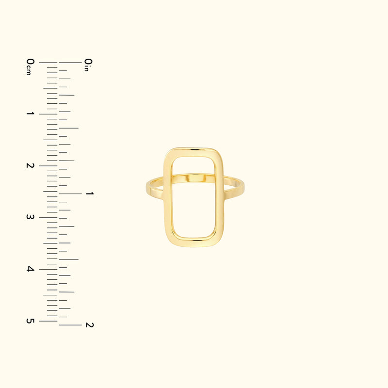 Gold geometric ring with an open rectangular design, displayed against a light background.