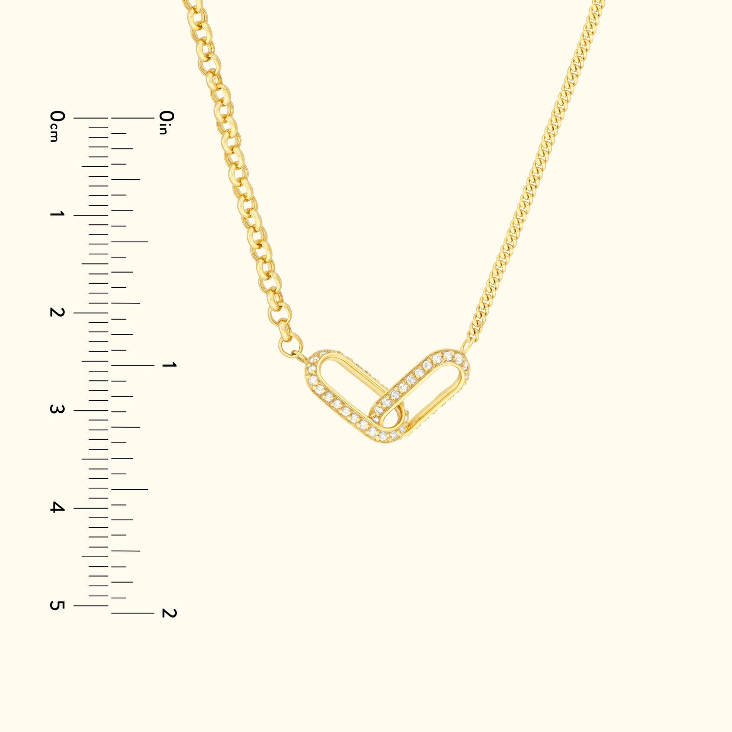 Gold chain necklace featuring a heart-shaped link adorned with small diamonds.