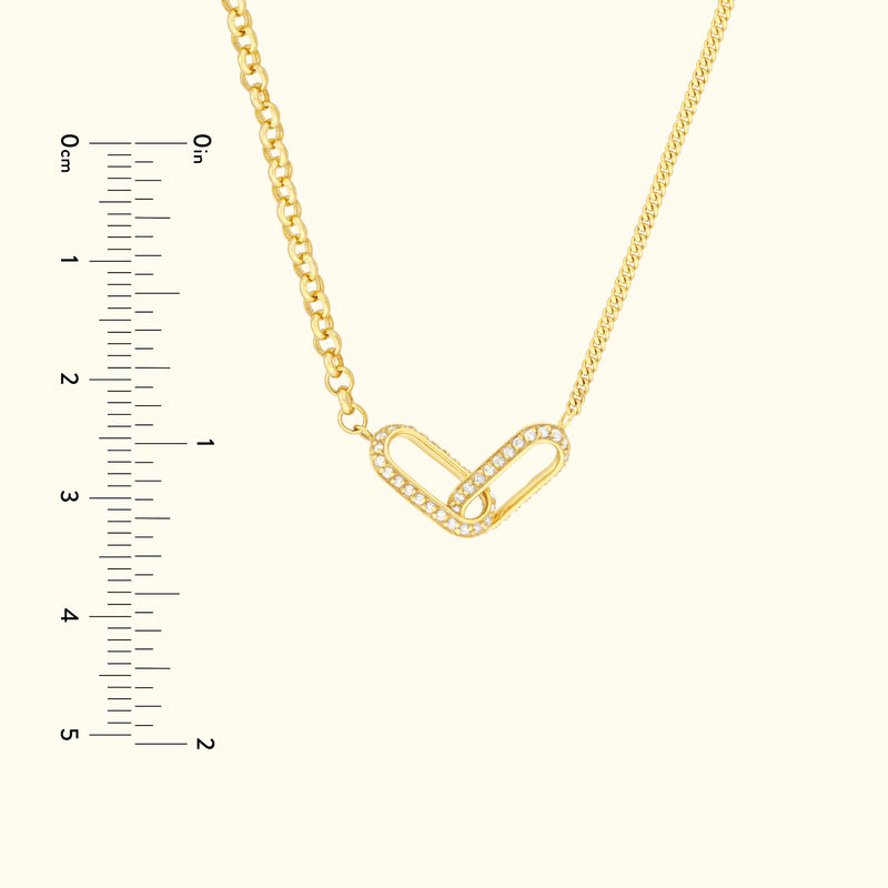 Gold chain necklace featuring a heart-shaped link adorned with small diamonds.