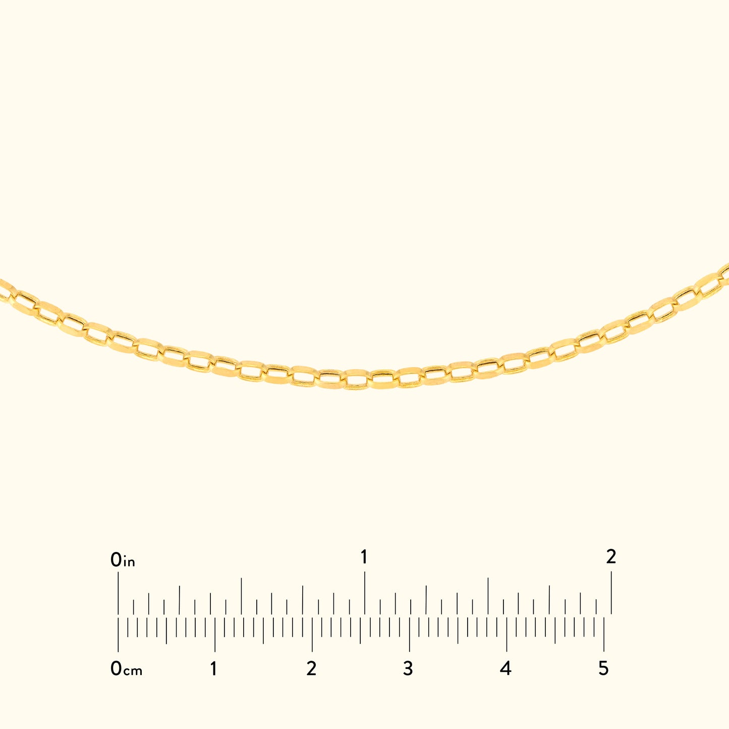 Gold chain necklace displayed horizontally with a ruler for size reference.