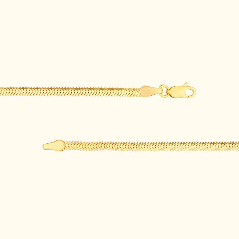 Delicate gold chain with a lobster clasp and textured links.