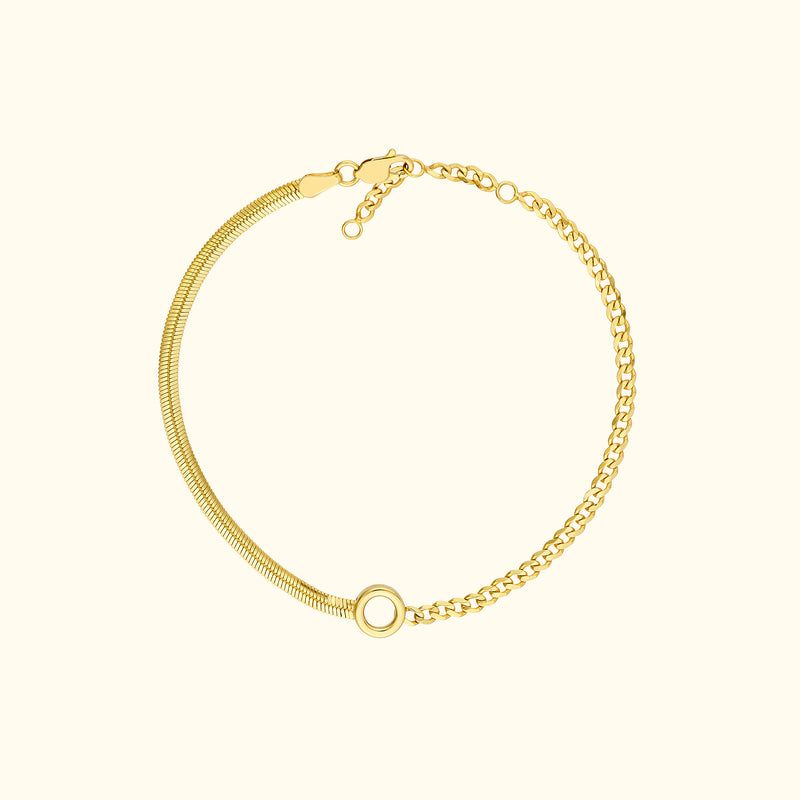 Gold bracelet featuring a mix of chain styles and a circular clasp.